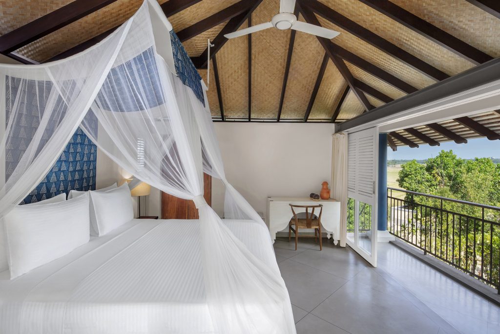Double bedroom with balcony at Ravana Garden as advertised by Kiwanao Hotels
