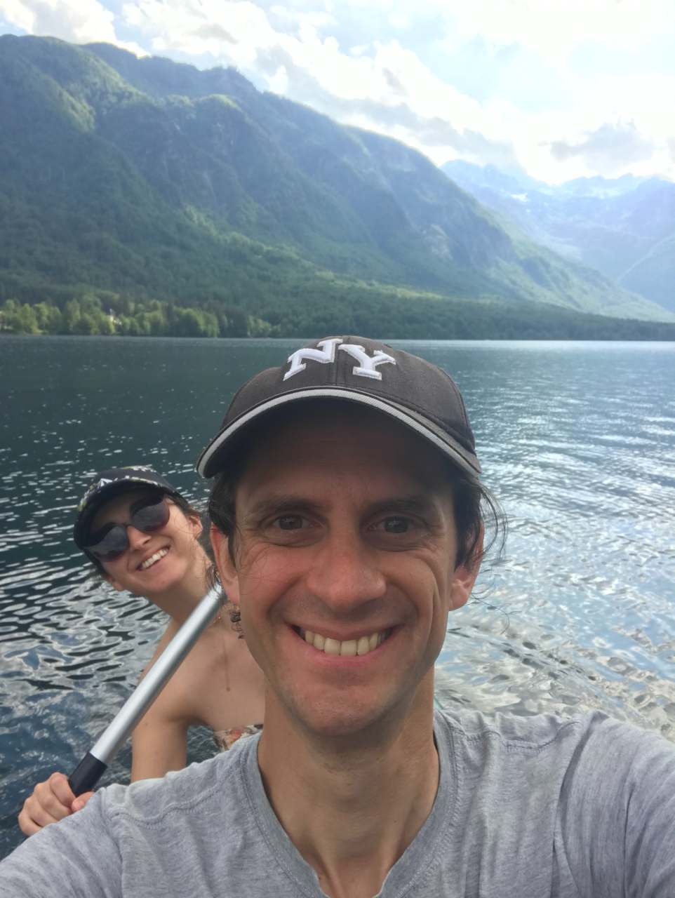 Two people enjoying Lake Bohinj in a canoe